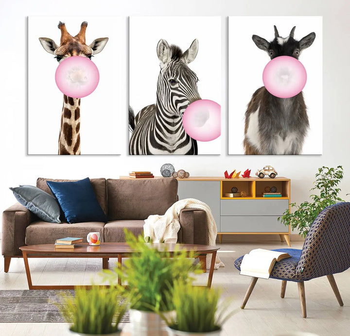 The "Funny Animals Canvas Wall Art Goat Zebra Giraffe Canvas Print" features a giraffe, zebra, and goat blowing pink bubblegum on museum-quality canvas, adding a playful touch to the space.