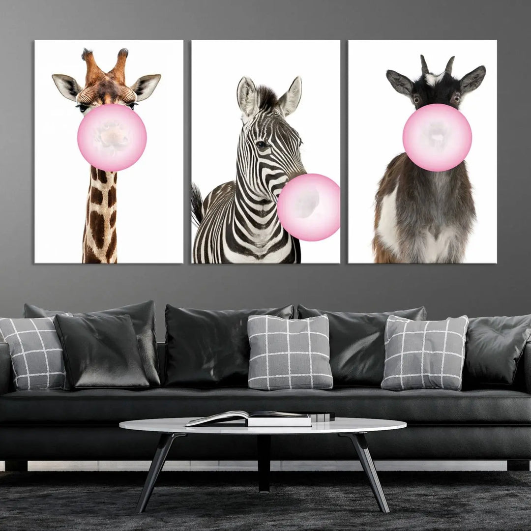 The "Funny Animals Canvas Wall Art Goat Zebra Giraffe Canvas Print" features a giraffe, zebra, and goat blowing pink bubblegum on museum-quality canvas, adding a playful touch to the space.