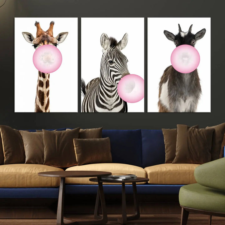 The "Funny Animals Canvas Wall Art Goat Zebra Giraffe Canvas Print" features a giraffe, zebra, and goat blowing pink bubblegum on museum-quality canvas, adding a playful touch to the space.