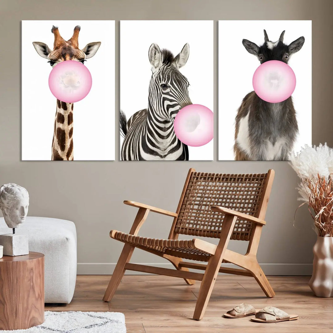 The "Funny Animals Canvas Wall Art Goat Zebra Giraffe Canvas Print" features a giraffe, zebra, and goat blowing pink bubblegum on museum-quality canvas, adding a playful touch to the space.