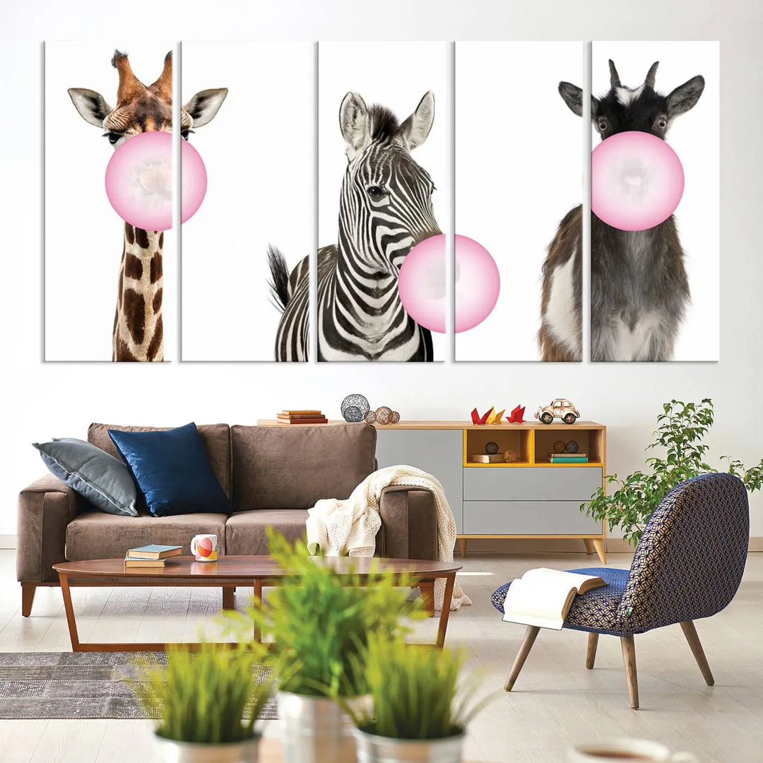 The "Funny Animals Canvas Wall Art Goat Zebra Giraffe Canvas Print" features a giraffe, zebra, and goat blowing pink bubblegum on museum-quality canvas, adding a playful touch to the space.