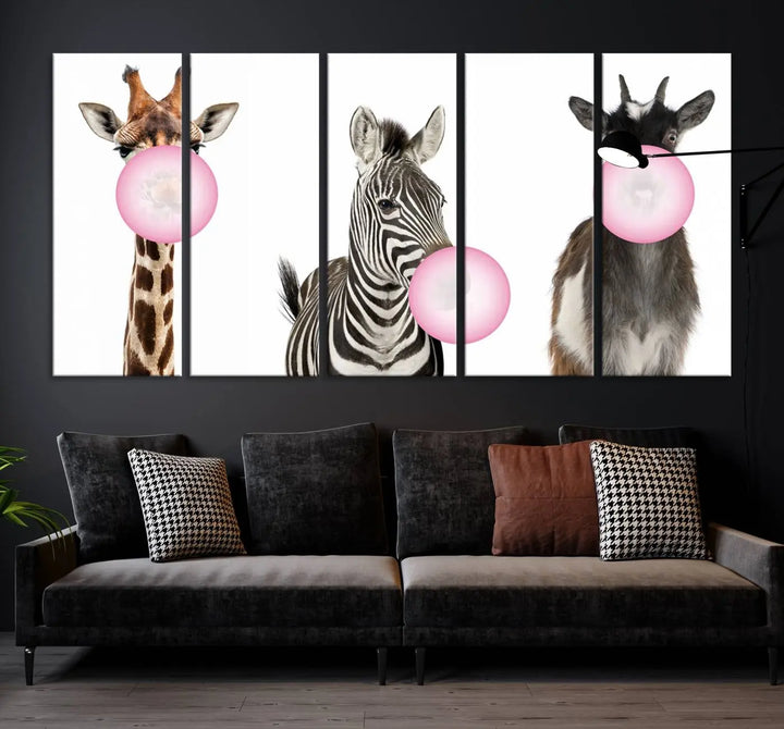 The "Funny Animals Canvas Wall Art Goat Zebra Giraffe Canvas Print" features a giraffe, zebra, and goat blowing pink bubblegum on museum-quality canvas, adding a playful touch to the space.