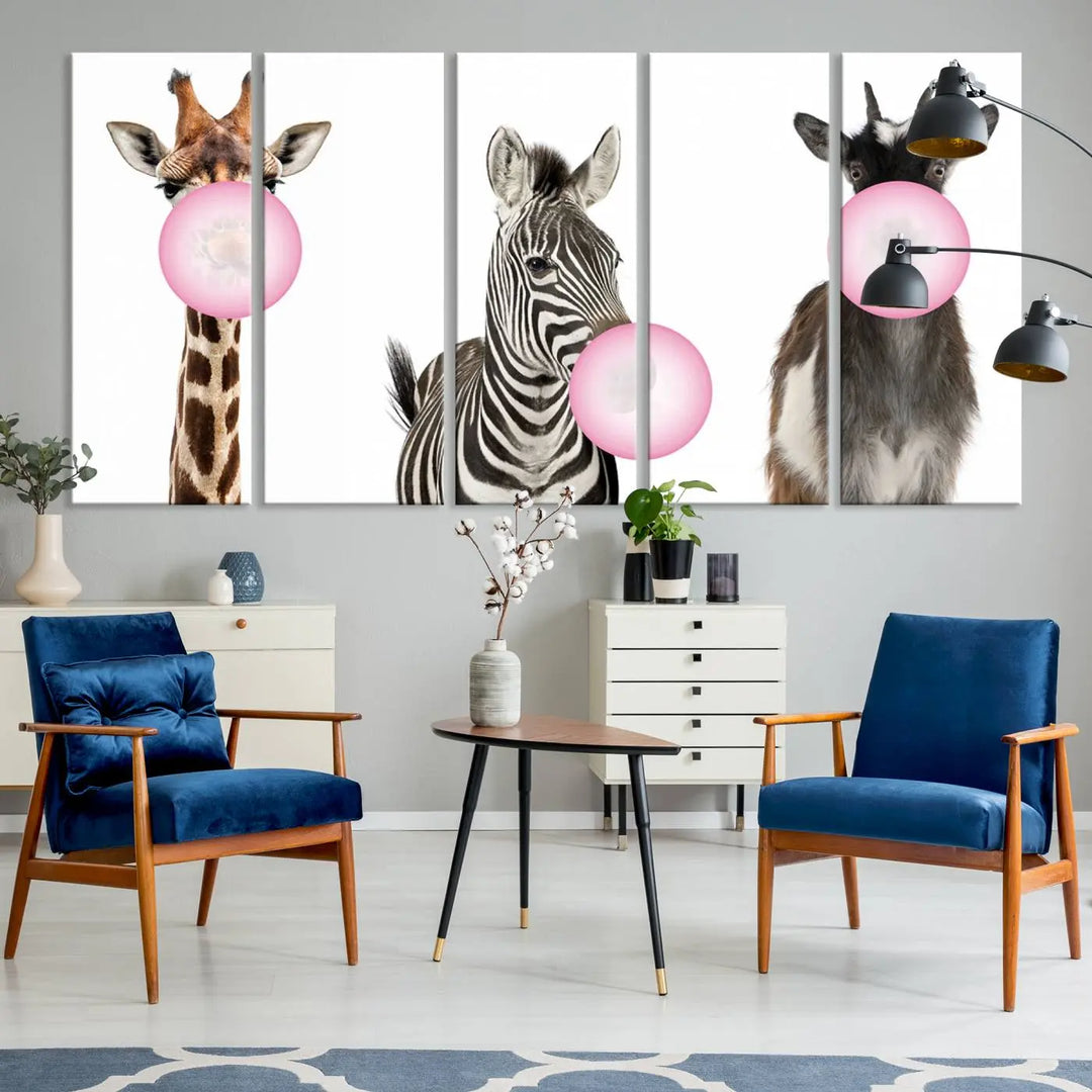 The "Funny Animals Canvas Wall Art Goat Zebra Giraffe Canvas Print" features a giraffe, zebra, and goat blowing pink bubblegum on museum-quality canvas, adding a playful touch to the space.