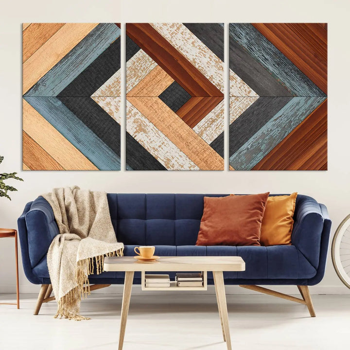 Above the blue sofa hangs the Geometric Wood Art Wall Decor Canvas Print, Rustic Wooden Pattern Triptych Wall Art for Living Room – Ready to Hang. This piece adds rustic charm to the space with its unique wall decor.