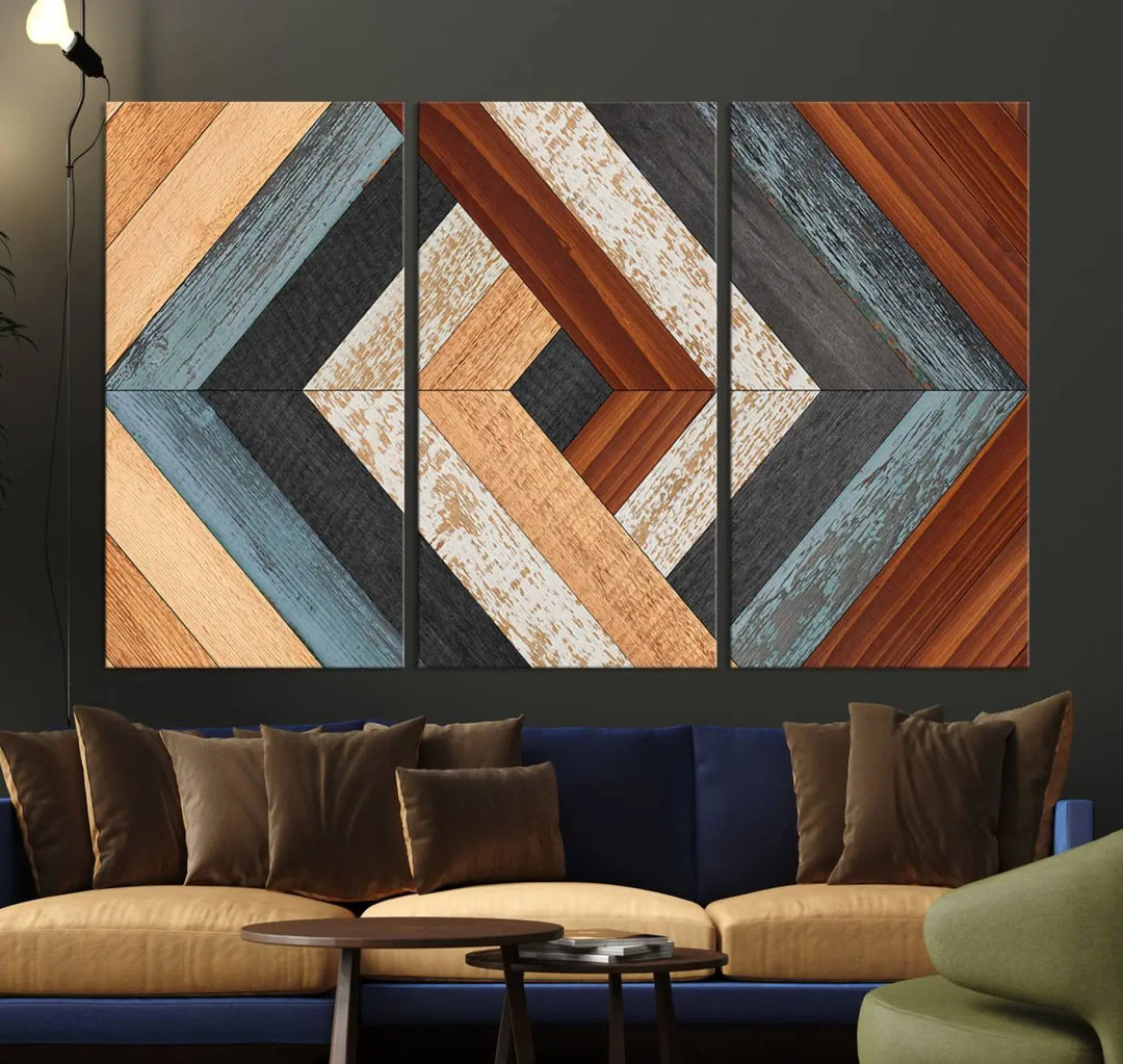 Above the blue sofa hangs the Geometric Wood Art Wall Decor Canvas Print, Rustic Wooden Pattern Triptych Wall Art for Living Room – Ready to Hang. This piece adds rustic charm to the space with its unique wall decor.