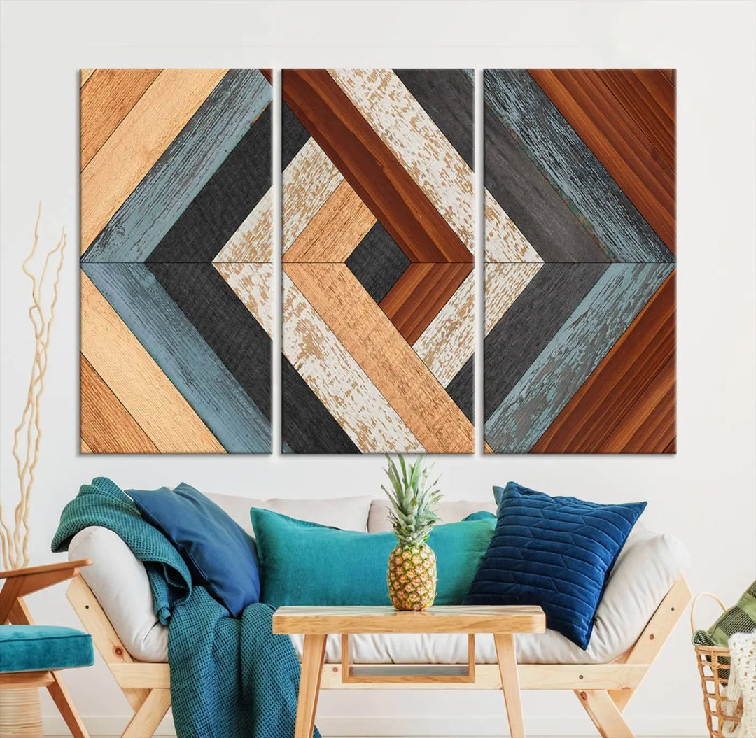 Above the blue sofa hangs the Geometric Wood Art Wall Decor Canvas Print, Rustic Wooden Pattern Triptych Wall Art for Living Room – Ready to Hang. This piece adds rustic charm to the space with its unique wall decor.