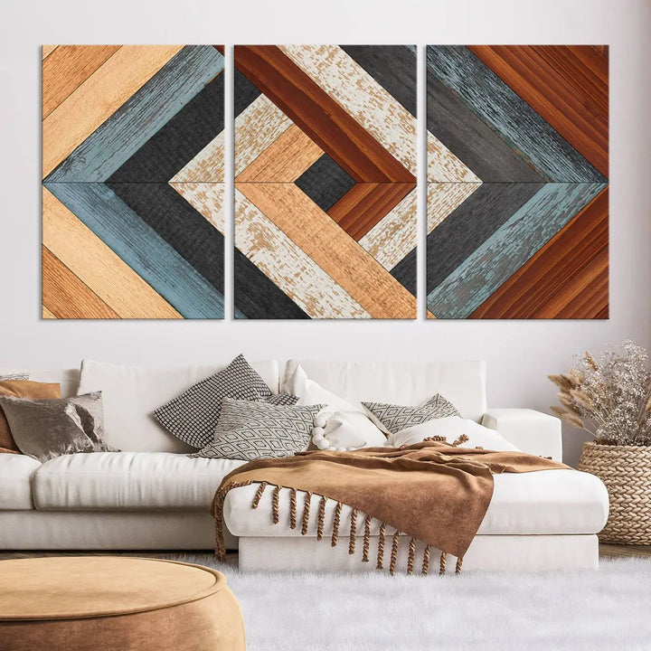 Above the blue sofa hangs the Geometric Wood Art Wall Decor Canvas Print, Rustic Wooden Pattern Triptych Wall Art for Living Room – Ready to Hang. This piece adds rustic charm to the space with its unique wall decor.