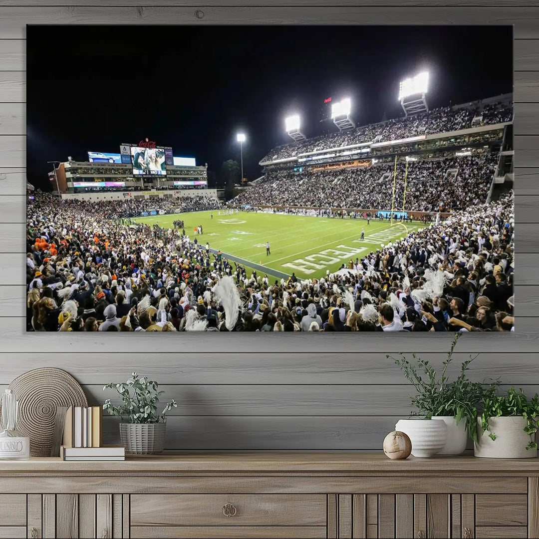 Showcased as premium wall art, this gallery-quality canvas features a print of the Georgia Tech Yellow Jackets Football Team at Atlanta's Bobby Dodd Stadium during a crowded, illuminated night game.