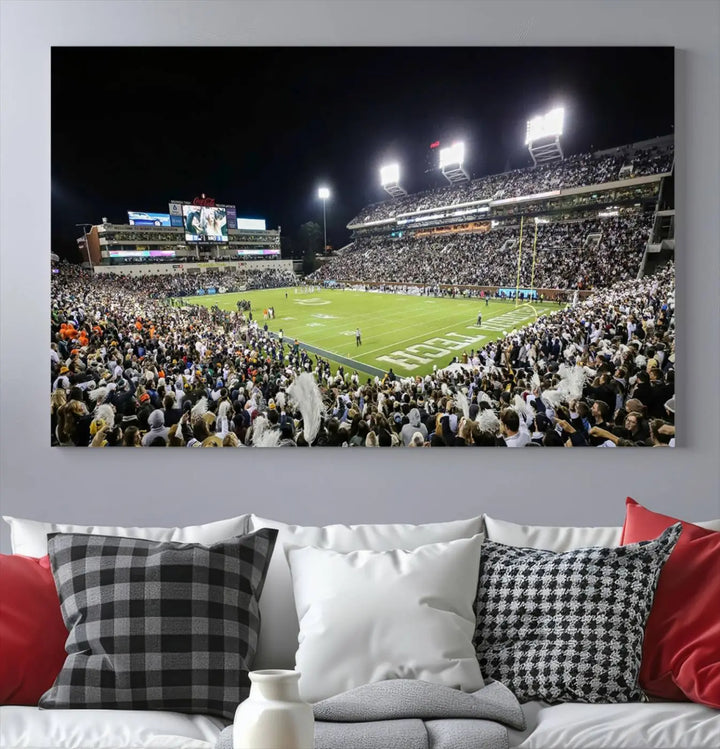 Showcased as premium wall art, this gallery-quality canvas features a print of the Georgia Tech Yellow Jackets Football Team at Atlanta's Bobby Dodd Stadium during a crowded, illuminated night game.