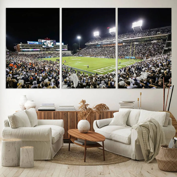 Showcased as premium wall art, this gallery-quality canvas features a print of the Georgia Tech Yellow Jackets Football Team at Atlanta's Bobby Dodd Stadium during a crowded, illuminated night game.