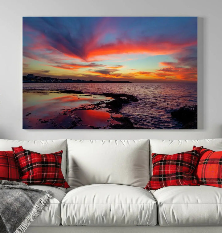 The Glorious Sunset on The Beach Wall Art Canvas Print features a vibrant sunset over rocky shores and is crafted on museum-quality canvas with a UV-protective coating.