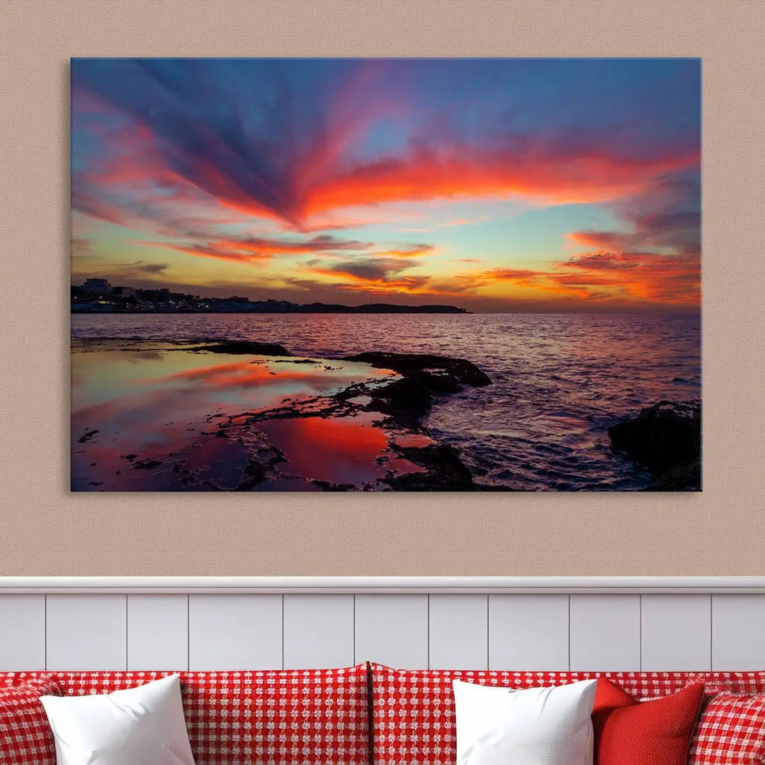 The Glorious Sunset on The Beach Wall Art Canvas Print features a vibrant sunset over rocky shores and is crafted on museum-quality canvas with a UV-protective coating.