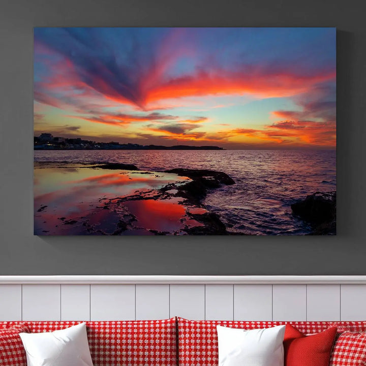 The Glorious Sunset on The Beach Wall Art Canvas Print features a vibrant sunset over rocky shores and is crafted on museum-quality canvas with a UV-protective coating.