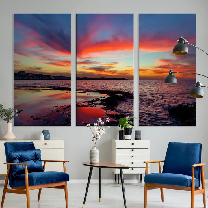 The Glorious Sunset on The Beach Wall Art Canvas Print features a vibrant sunset over rocky shores and is crafted on museum-quality canvas with a UV-protective coating.