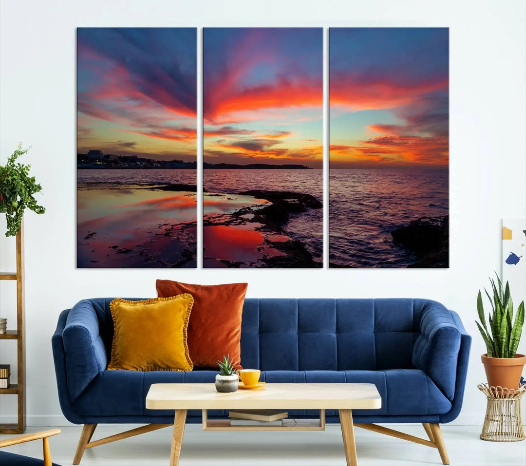 The Glorious Sunset on The Beach Wall Art Canvas Print features a vibrant sunset over rocky shores and is crafted on museum-quality canvas with a UV-protective coating.