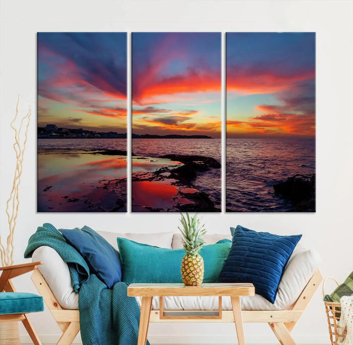 The Glorious Sunset on The Beach Wall Art Canvas Print features a vibrant sunset over rocky shores and is crafted on museum-quality canvas with a UV-protective coating.