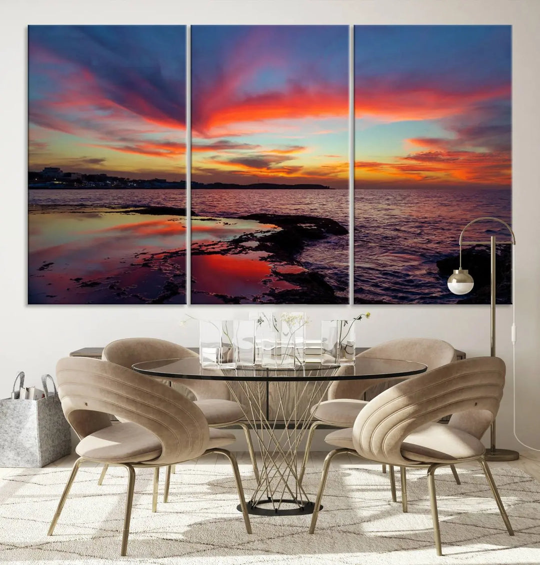 The Glorious Sunset on The Beach Wall Art Canvas Print features a vibrant sunset over rocky shores and is crafted on museum-quality canvas with a UV-protective coating.