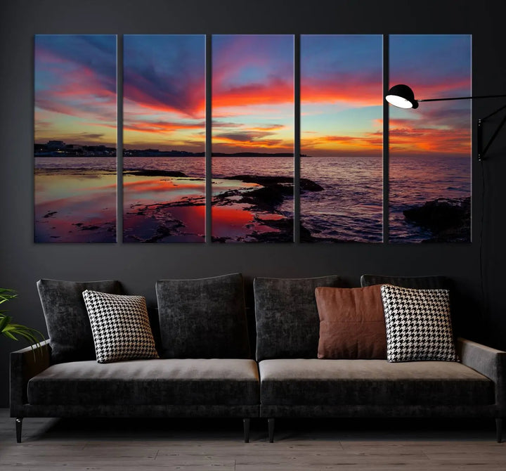 The Glorious Sunset on The Beach Wall Art Canvas Print features a vibrant sunset over rocky shores and is crafted on museum-quality canvas with a UV-protective coating.