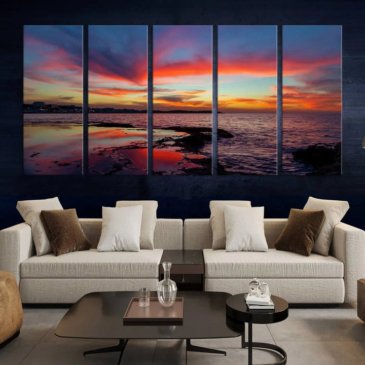 The Glorious Sunset on The Beach Wall Art Canvas Print features a vibrant sunset over rocky shores and is crafted on museum-quality canvas with a UV-protective coating.