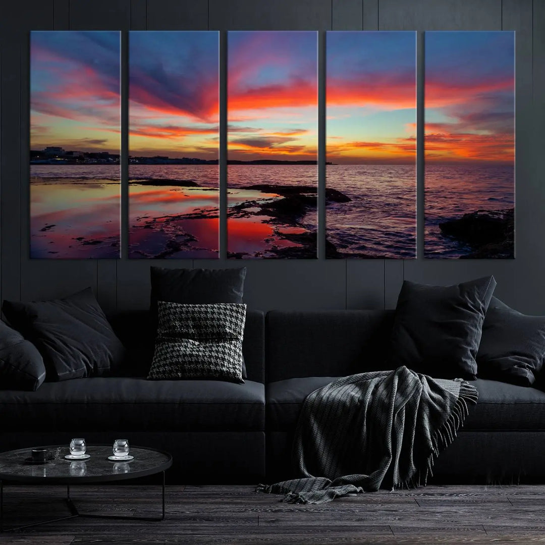 The Glorious Sunset on The Beach Wall Art Canvas Print features a vibrant sunset over rocky shores and is crafted on museum-quality canvas with a UV-protective coating.