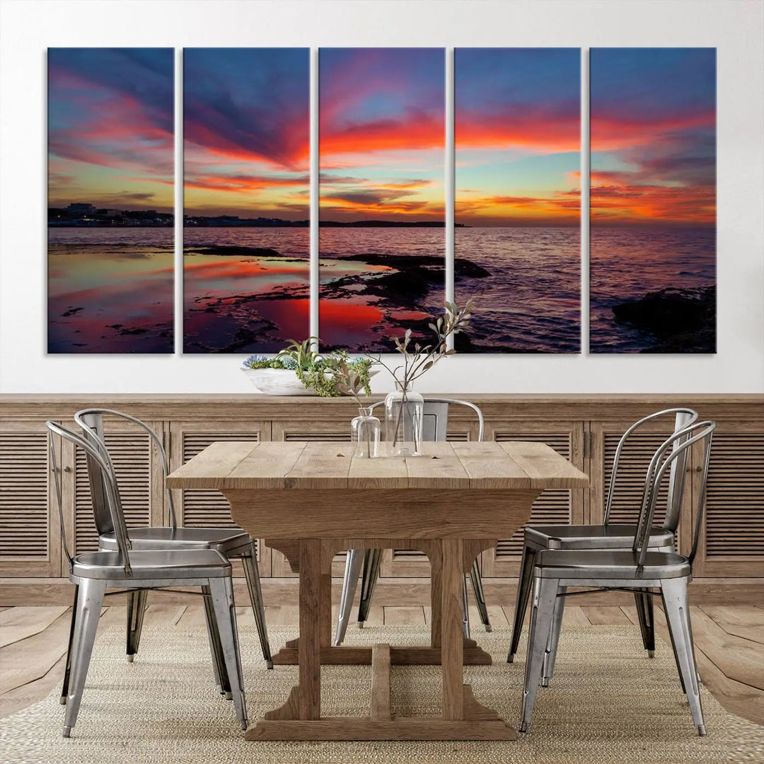 The Glorious Sunset on The Beach Wall Art Canvas Print features a vibrant sunset over rocky shores and is crafted on museum-quality canvas with a UV-protective coating.