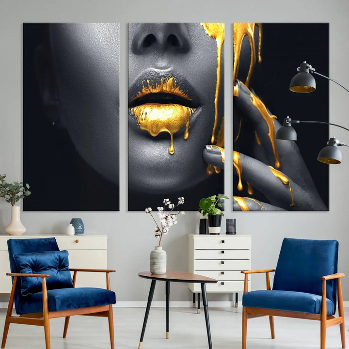 The modern living room features a striking triptych called the "Gold Glitter Lips Fashion Photography Wall Art Makeup" canvas print.