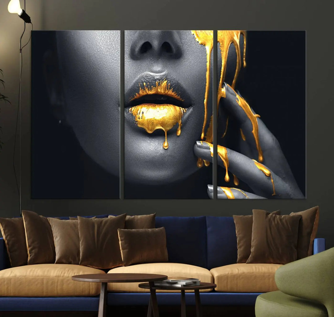 The modern living room features a striking triptych called the "Gold Glitter Lips Fashion Photography Wall Art Makeup" canvas print.