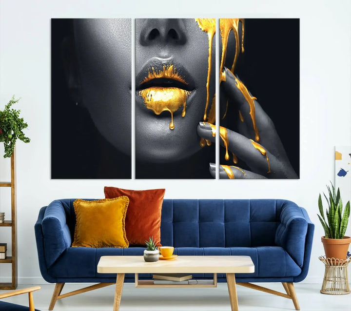 The modern living room features a striking triptych called the "Gold Glitter Lips Fashion Photography Wall Art Makeup" canvas print.