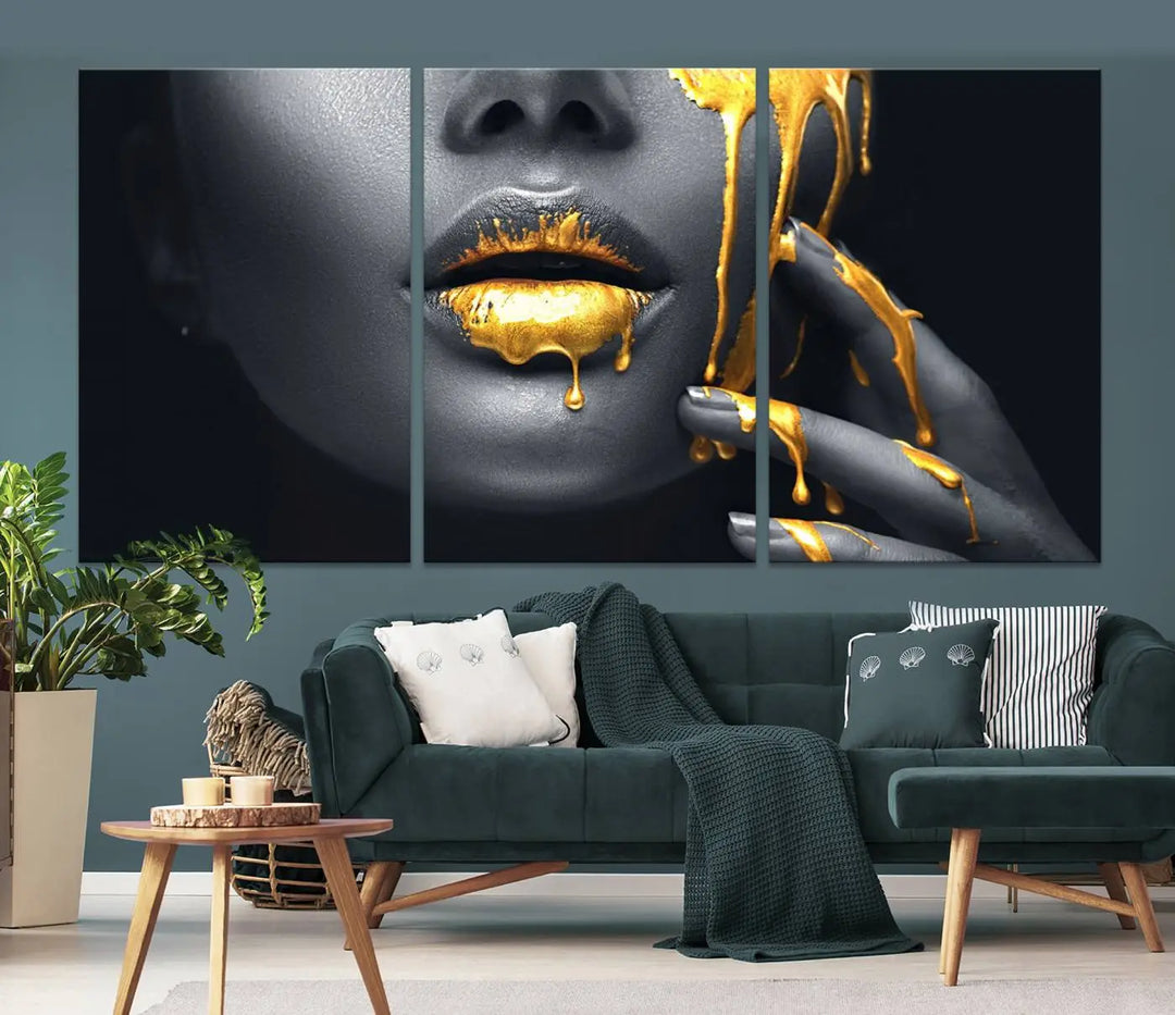 The modern living room features a striking triptych called the "Gold Glitter Lips Fashion Photography Wall Art Makeup" canvas print.