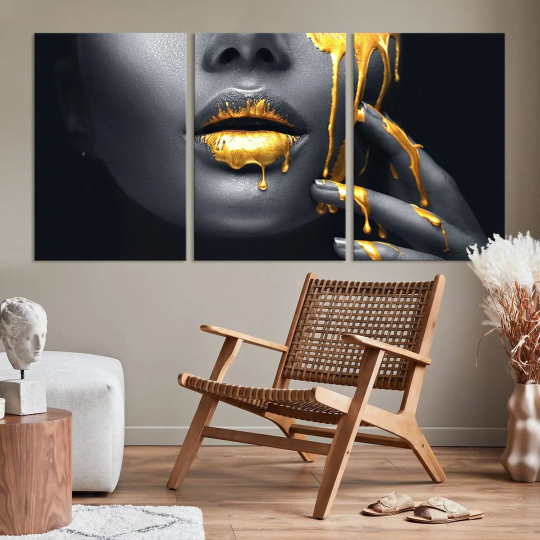 The modern living room features a striking triptych called the "Gold Glitter Lips Fashion Photography Wall Art Makeup" canvas print.