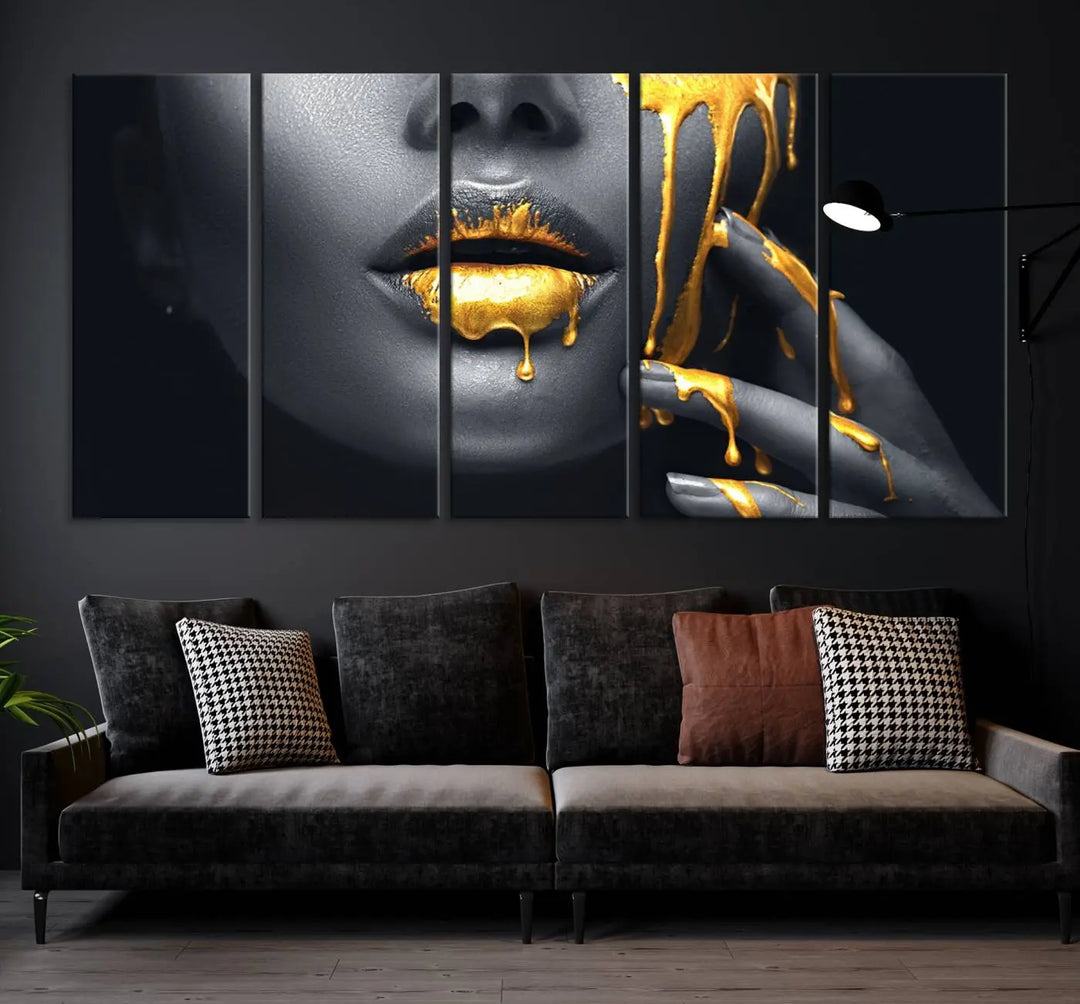 The modern living room features a striking triptych called the "Gold Glitter Lips Fashion Photography Wall Art Makeup" canvas print.