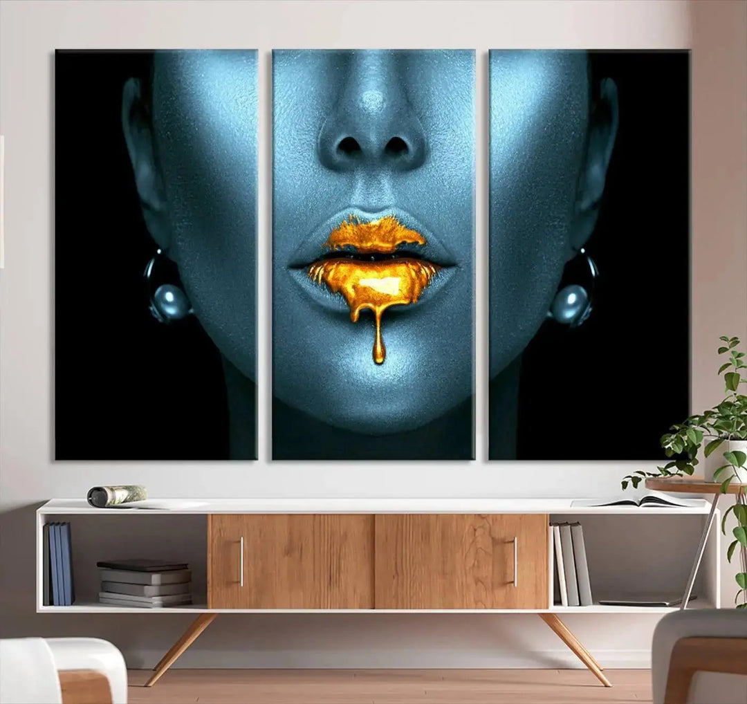 The wall showcases the Gold Glitter Lips Wall Art Lips Canvas Art Print, featuring a striking blue metallic face with gold glitter lips. This piece effortlessly incorporates modern aesthetics into your living space.