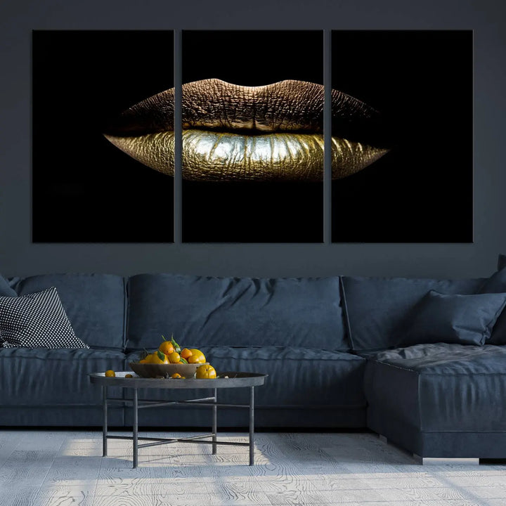 The contemporary living room is enhanced by the eye-catching Gold Lips Makeup Canvas Wall Art Fashion Beauty Canvas Print, presented in three panels.