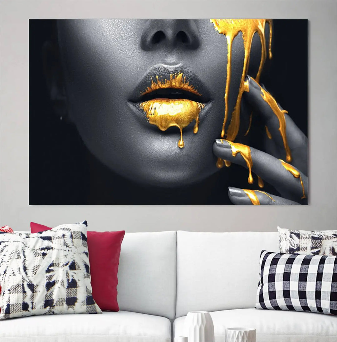 A modern living room featuring the "Gold Lips and Black Woman Makeup Canvas Print" adds a contemporary art style.