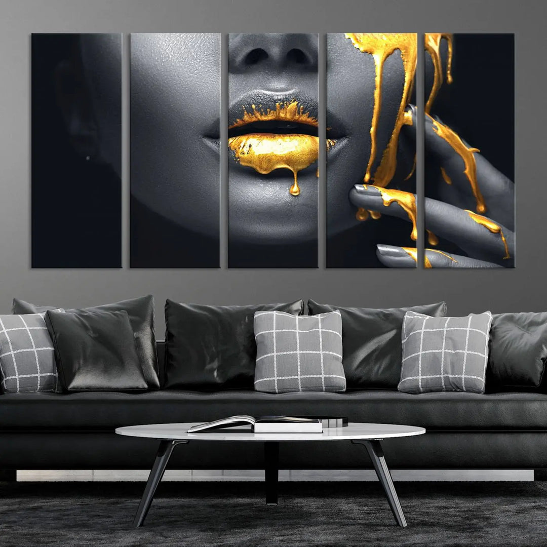 A modern living room featuring the "Gold Lips and Black Woman Makeup Canvas Print" adds a contemporary art style.