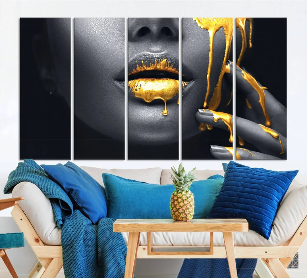 A modern living room featuring the "Gold Lips and Black Woman Makeup Canvas Print" adds a contemporary art style.