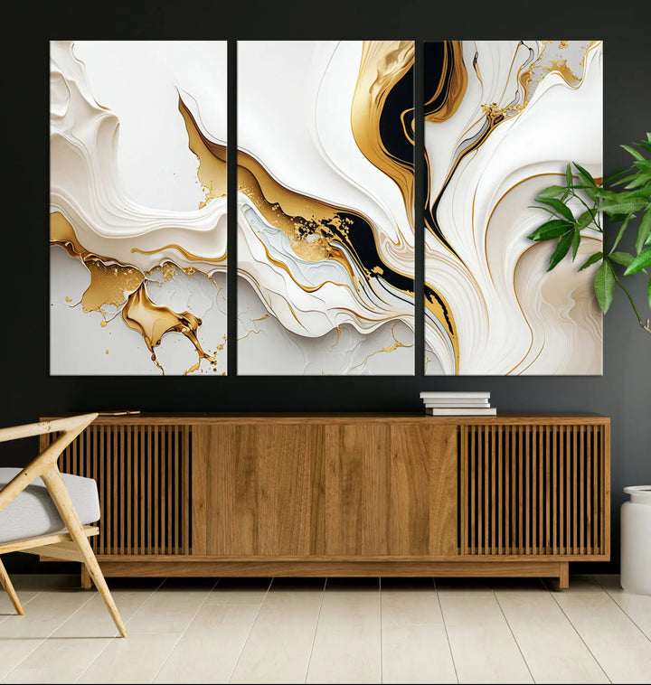 Three Gold Waves on Pure White art pieces adorn a dark wall.