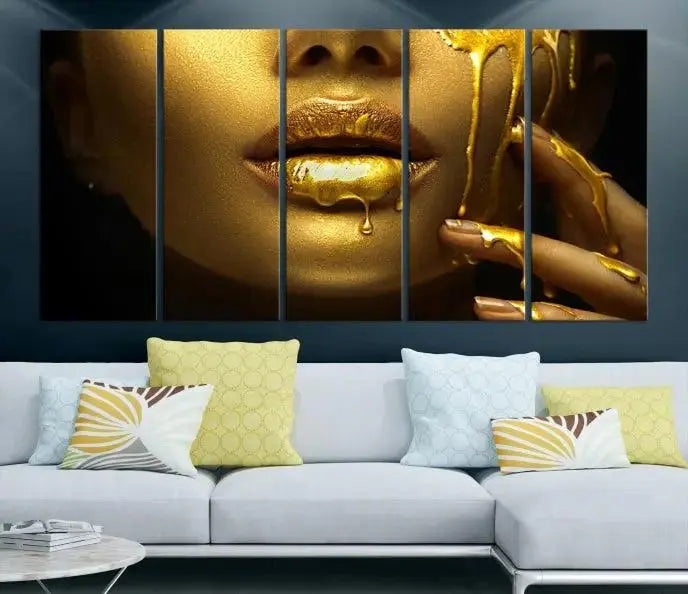 The Gold and Women Wall Art Canvas Print, with its exquisite golden depiction of a face and hand, elegantly adorns the space, bringing luxurious gold accents to this stylish living room.