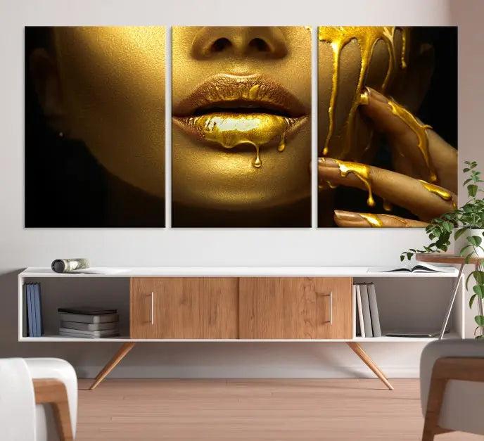 The Gold and Women Wall Art Canvas Print, with its exquisite golden depiction of a face and hand, elegantly adorns the space, bringing luxurious gold accents to this stylish living room.