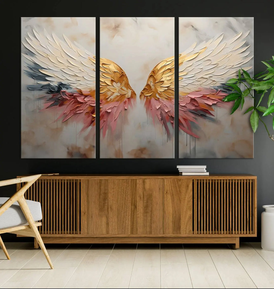 The "Golden Angel Wings Wall Art Canvas Print – Stunning Abstract Winged Art for Elegant Home Decor – Ready to Hang" adorns the dark wall above, showcasing an elegant triptych with abstract gold and pink hues.