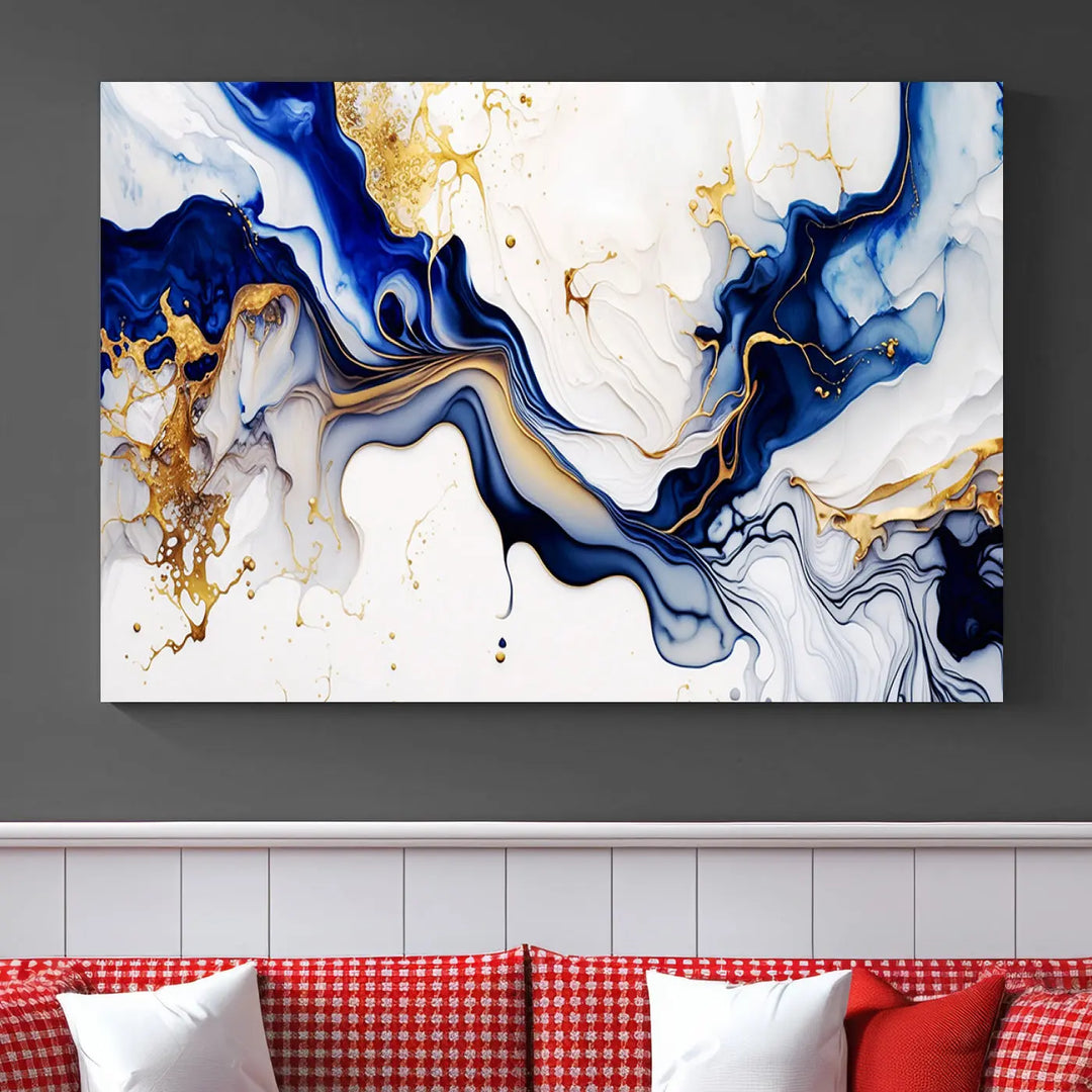 Enhance your modern home decor with the "Golden Cascades on Midnight Blue – Abstract Flowing Elegance" wall art canvas. This stunning piece features dynamic blue, gold, and white patterns. The triptych design comes framed and ready to hang, infusing any space with artistic expression.