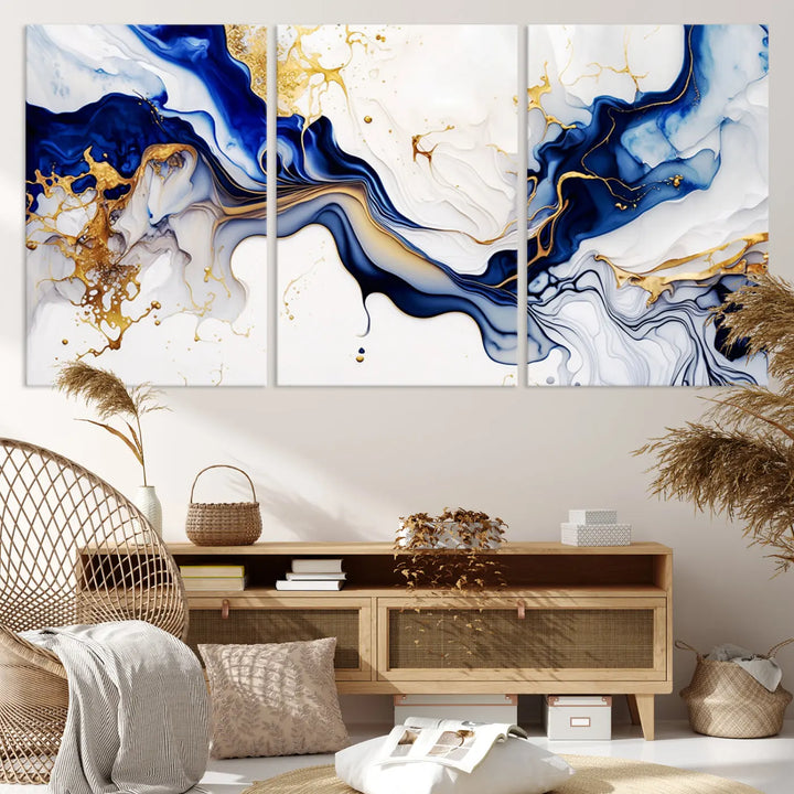 Enhance your modern home decor with the "Golden Cascades on Midnight Blue – Abstract Flowing Elegance" wall art canvas. This stunning piece features dynamic blue, gold, and white patterns. The triptych design comes framed and ready to hang, infusing any space with artistic expression.