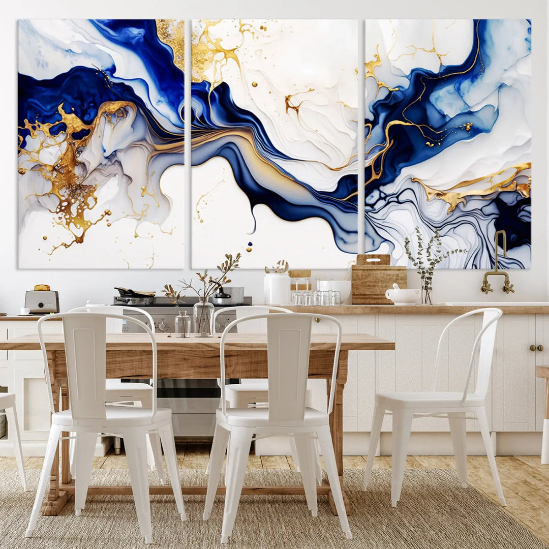 Enhance your modern home decor with the "Golden Cascades on Midnight Blue – Abstract Flowing Elegance" wall art canvas. This stunning piece features dynamic blue, gold, and white patterns. The triptych design comes framed and ready to hang, infusing any space with artistic expression.