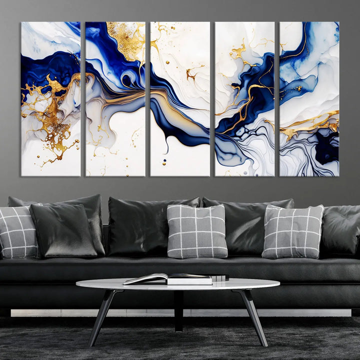 Enhance your modern home decor with the "Golden Cascades on Midnight Blue – Abstract Flowing Elegance" wall art canvas. This stunning piece features dynamic blue, gold, and white patterns. The triptych design comes framed and ready to hang, infusing any space with artistic expression.