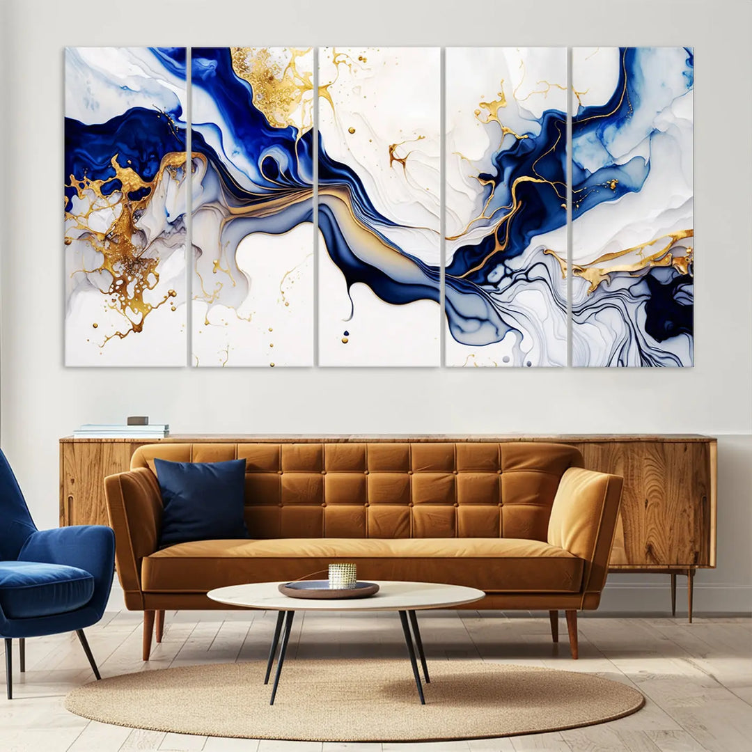 Enhance your modern home decor with the "Golden Cascades on Midnight Blue – Abstract Flowing Elegance" wall art canvas. This stunning piece features dynamic blue, gold, and white patterns. The triptych design comes framed and ready to hang, infusing any space with artistic expression.