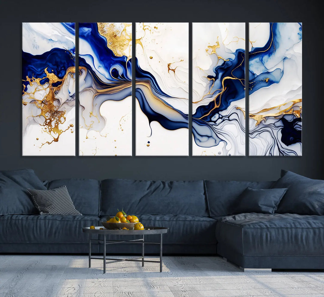 Enhance your modern home decor with the "Golden Cascades on Midnight Blue – Abstract Flowing Elegance" wall art canvas. This stunning piece features dynamic blue, gold, and white patterns. The triptych design comes framed and ready to hang, infusing any space with artistic expression.