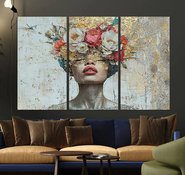 A triptych of the Golden Petal Silhouette Woman Wall Art Canvas Print showcases an abstract portrait featuring a woman adorned with flowers on her head.