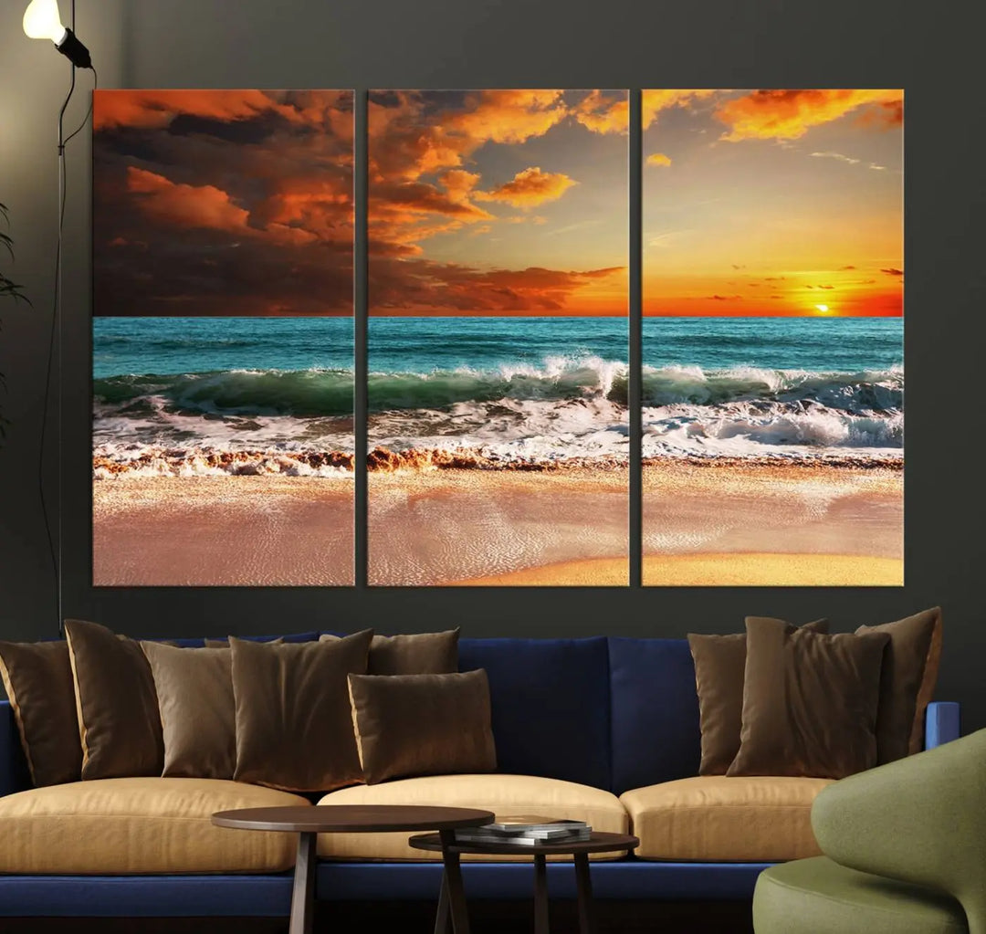 The living room features the stunning Golden Sunset Beach Canvas Wall Art—Triptych Seascape Print—framed and ready to hang on the wall.