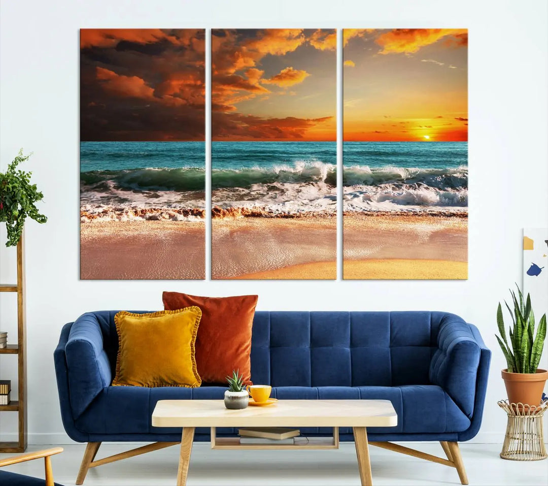 The living room features the stunning Golden Sunset Beach Canvas Wall Art—Triptych Seascape Print—framed and ready to hang on the wall.