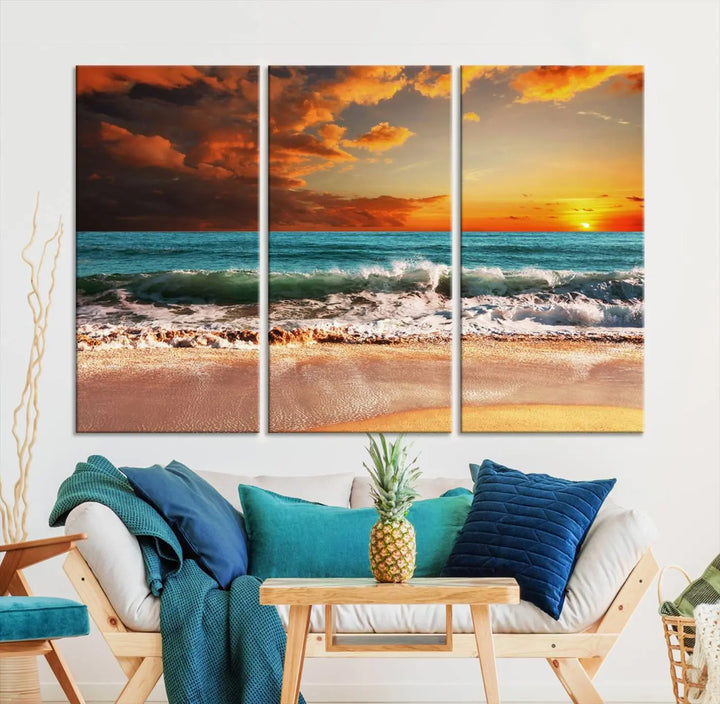 The living room features the stunning Golden Sunset Beach Canvas Wall Art—Triptych Seascape Print—framed and ready to hang on the wall.